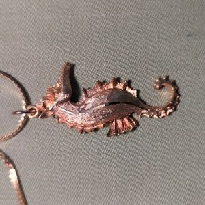 Golden seahorse necklace